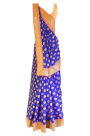 Royal blue chiffon sari with gold pin wheels embroidery. Heavy gold border with pink trim.  