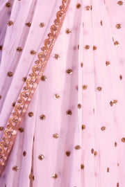 White chiffon sari covered in gold sequin polka dots and a beautiful thin gold border.