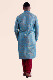 Vibrant blue Kurta with embroidered collar, and red thread work. Paired with deep red mahogany draw string bottoms.
