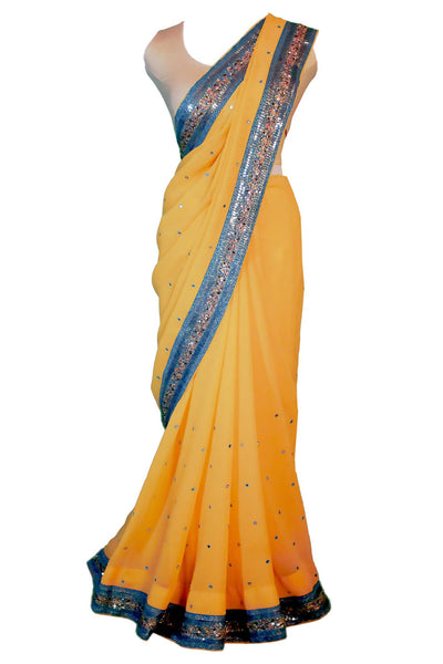 Yellow chiffon sari, sequence through out the yellow with a beautiful border in blue with more detail sequence, a perfect combination of elegance and chic. 