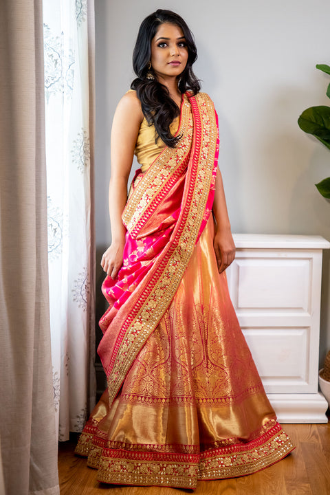 Tropic like it's hot  Magical gold and red bridal lehenga covered in gold embroidery, with rich hues of red running through. Paired with metallic red dupatta covered in gold flowers and leaves.  Skirt Length: 44 inches (Can not be altered)