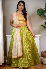 Mojitos and me, mint to be  Green and gold lehenga with gold printed work, paired with gold dupatta and blouse.   Skirt Length: 40 (Can not be altered)  Note: Blouse style and complimentary jewelry may vary depending on size and availability.