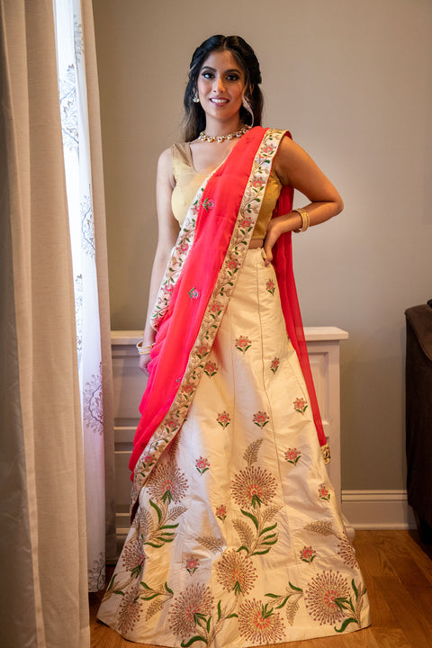High tides, good vibes, and great time!  Ravishing cream lehenga with detailed work throughout, paired with pink contrast dupatta and gold blouse.   Skirt Length: 44 inches inches   Note: Blouse style and complimentary jewelry may vary depending on availability.