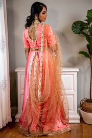 Smooth and Sweet  Peach skirt with drawstring, matching colored blouse with detailed pearl and gold dupatta.   Skirt Length: 40 (Can not be altered) Sleeve Measurements: Arm Hole: 18 inches, Bicep 12 inches, Elbow 10 inches   Note: Blouse style and complimentary jewelry may vary depending on size and availability.