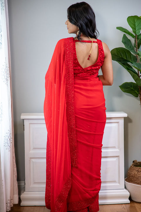 If you were looking for a sign, here it is...  Red chiffon sari with bead work on the border.     Note: Sari comes with a petticoat, blouse, and jewelry. 