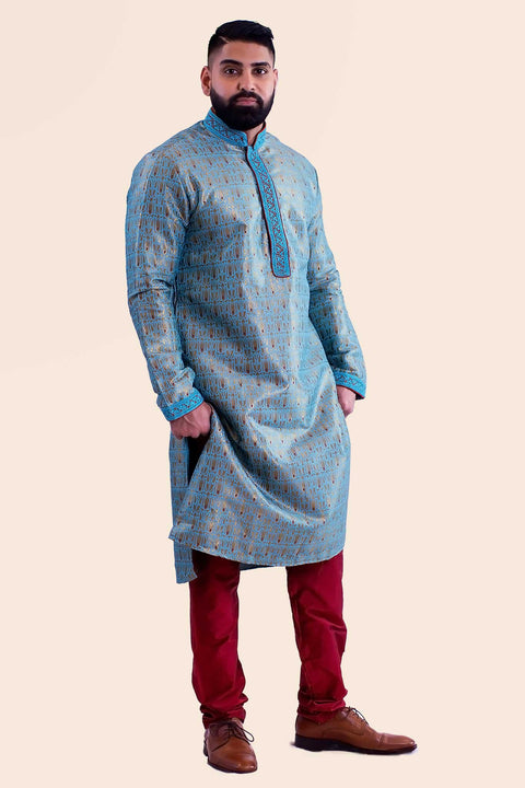 Vibrant blue Kurta with embroidered collar, and red thread work. Paired with deep red mahogany draw string bottoms.