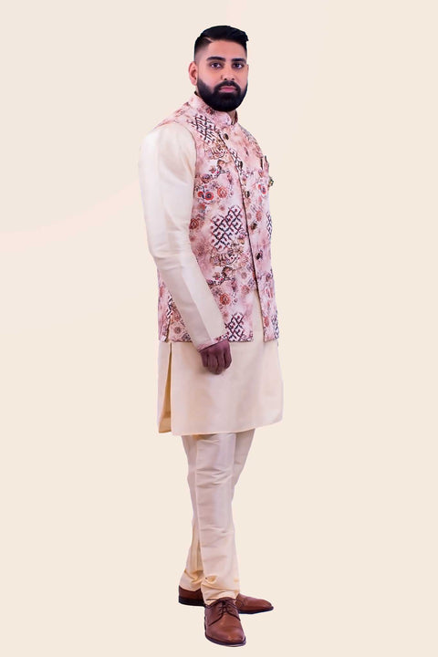 Three piece champagne colored kurta paired with cherry blossom print sherwani, paired with matching champagne colored pants.